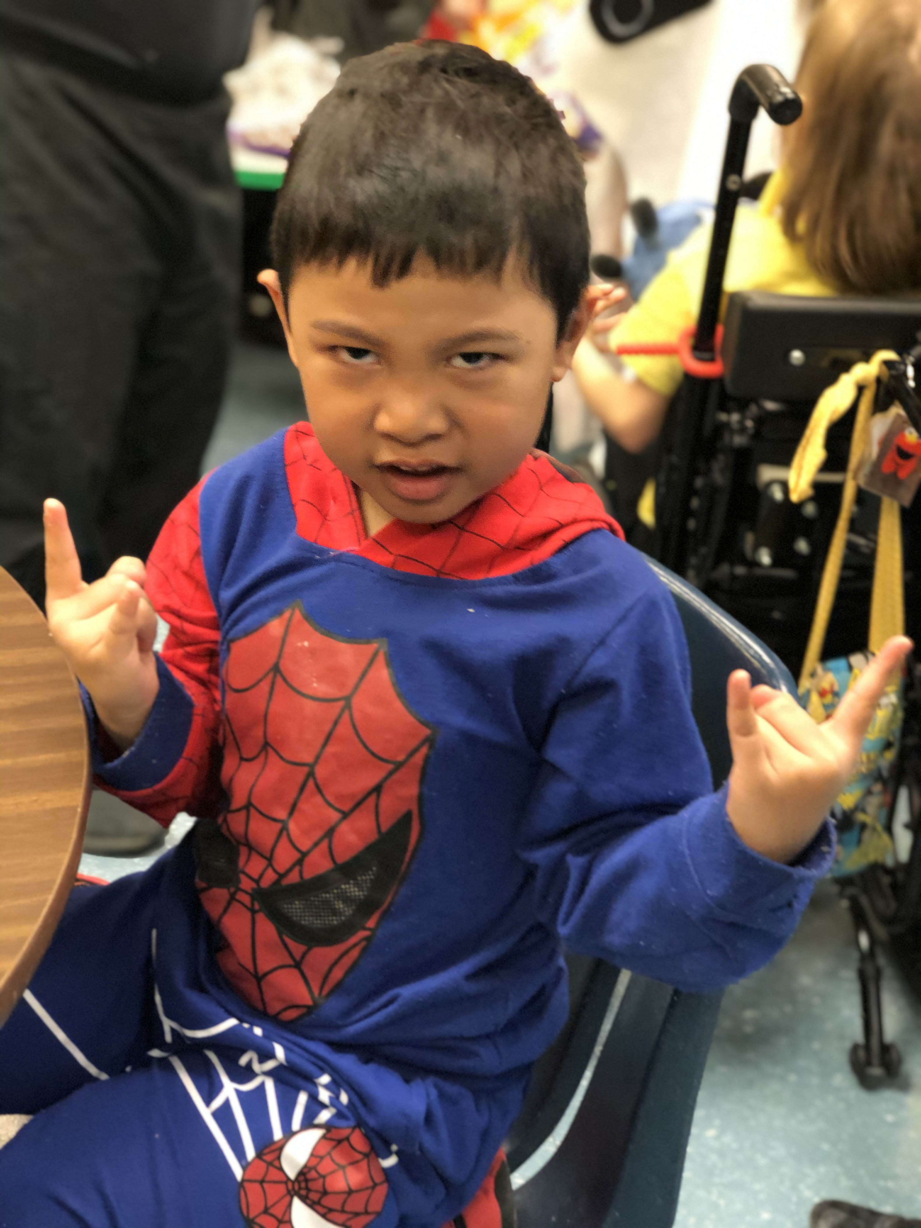 a student in a spiderman costume