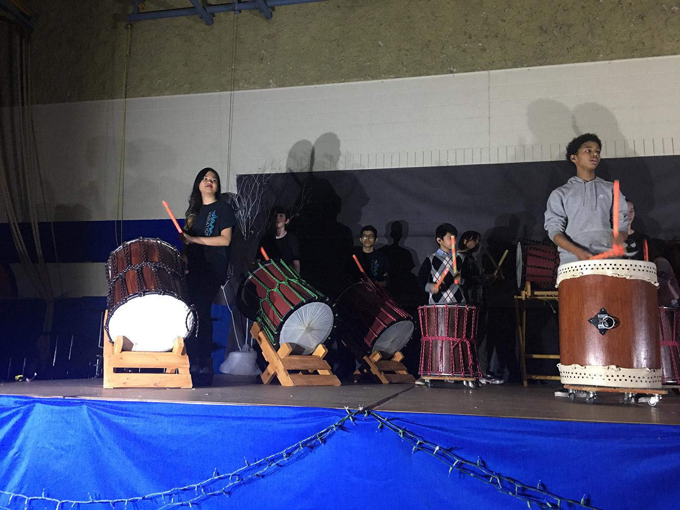students perform on the drums
