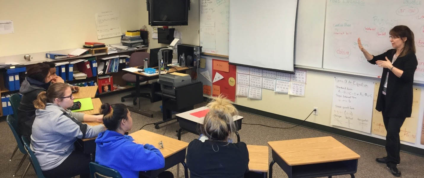 teacher using asl to teach math to students